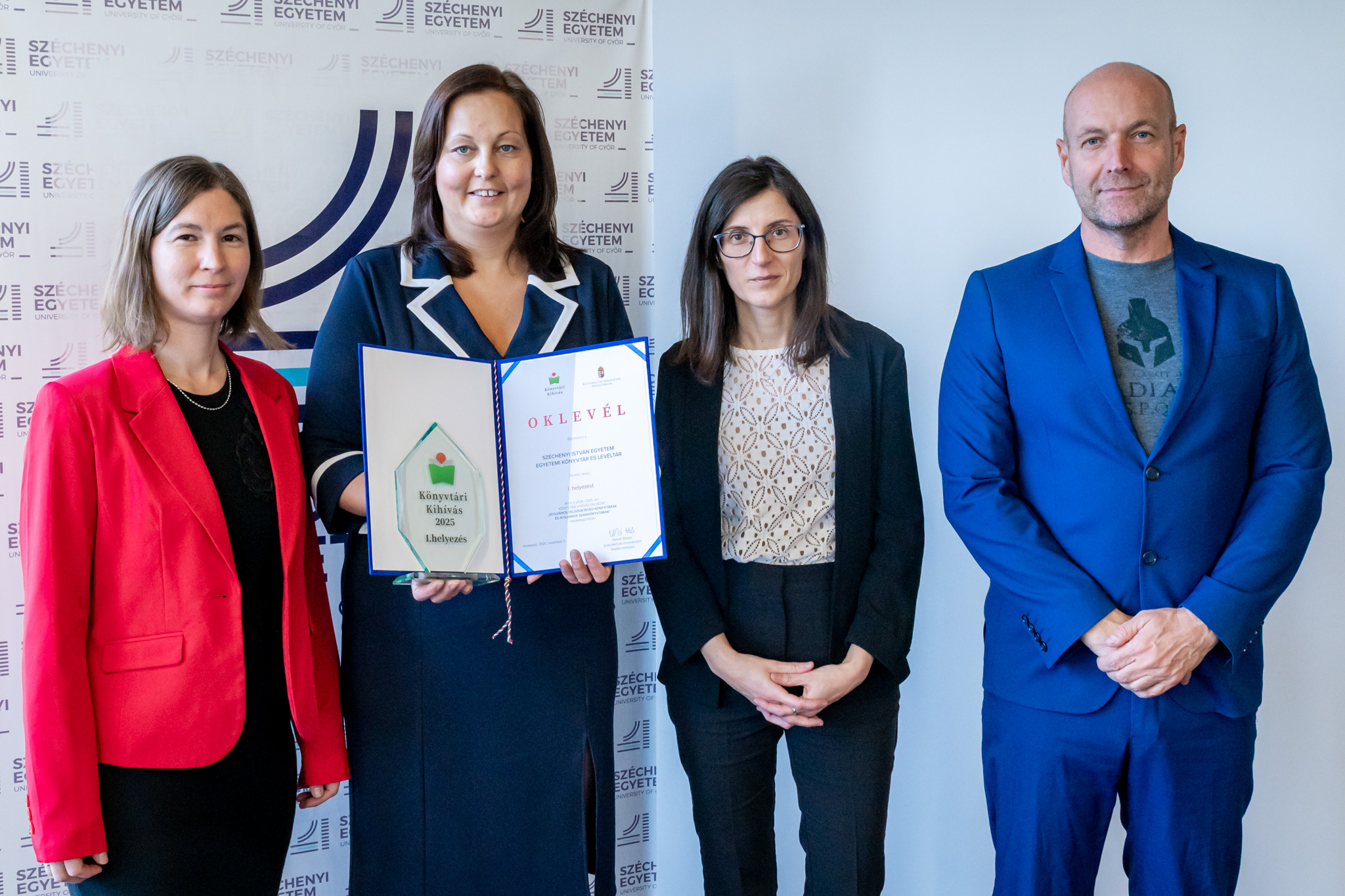 Staff of the Széchenyi István University Library and Archives at the award ceremony. Pictured: Eszter Tóthné Marek, Head of Centre; Csilla Tóth, Director; Henrietta Tóth and Péter Hegedüs, Heads of Department (Photo: András Adorján)